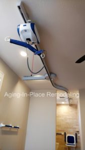 Patient ceiling lift installed allowing safe transfer from bed to bathroom for transfer to toilet and shower