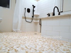 Accessible Renovations wheelchair accessible bathroom remodel with tile roll-in shower, grab bars and fold up shower seat